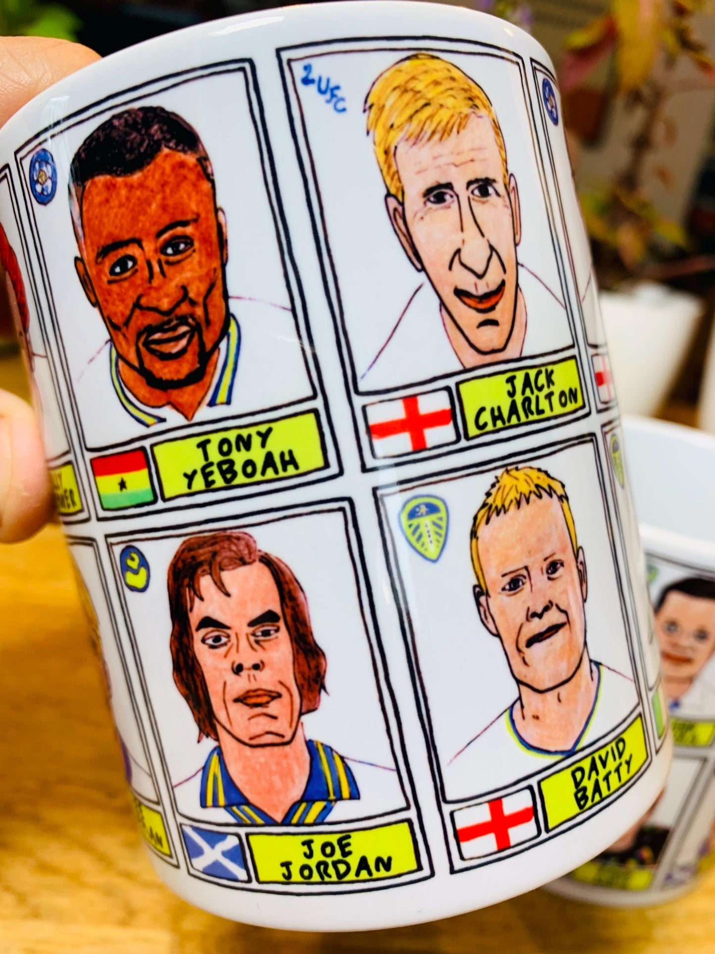 Leeds United Vol 1 No Score Draws Mug Set - Set of TWO 11oz Ceramic Mugs with Wonky Panini-style No Score Draws Doodles of LUFC legends