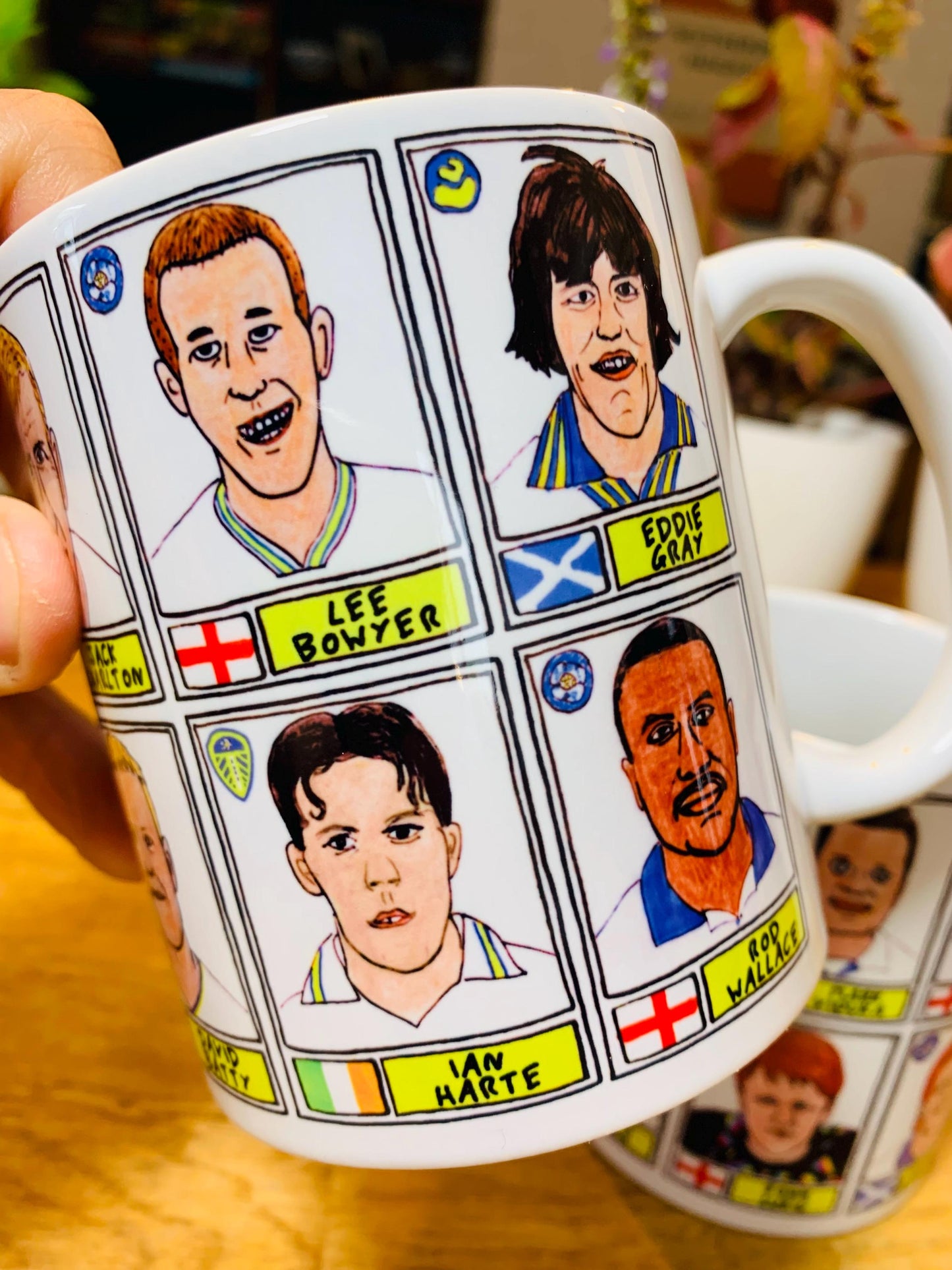 Leeds United Vol 1 No Score Draws Mug Set - Set of TWO 11oz Ceramic Mugs with Wonky Panini-style No Score Draws Doodles of LUFC legends