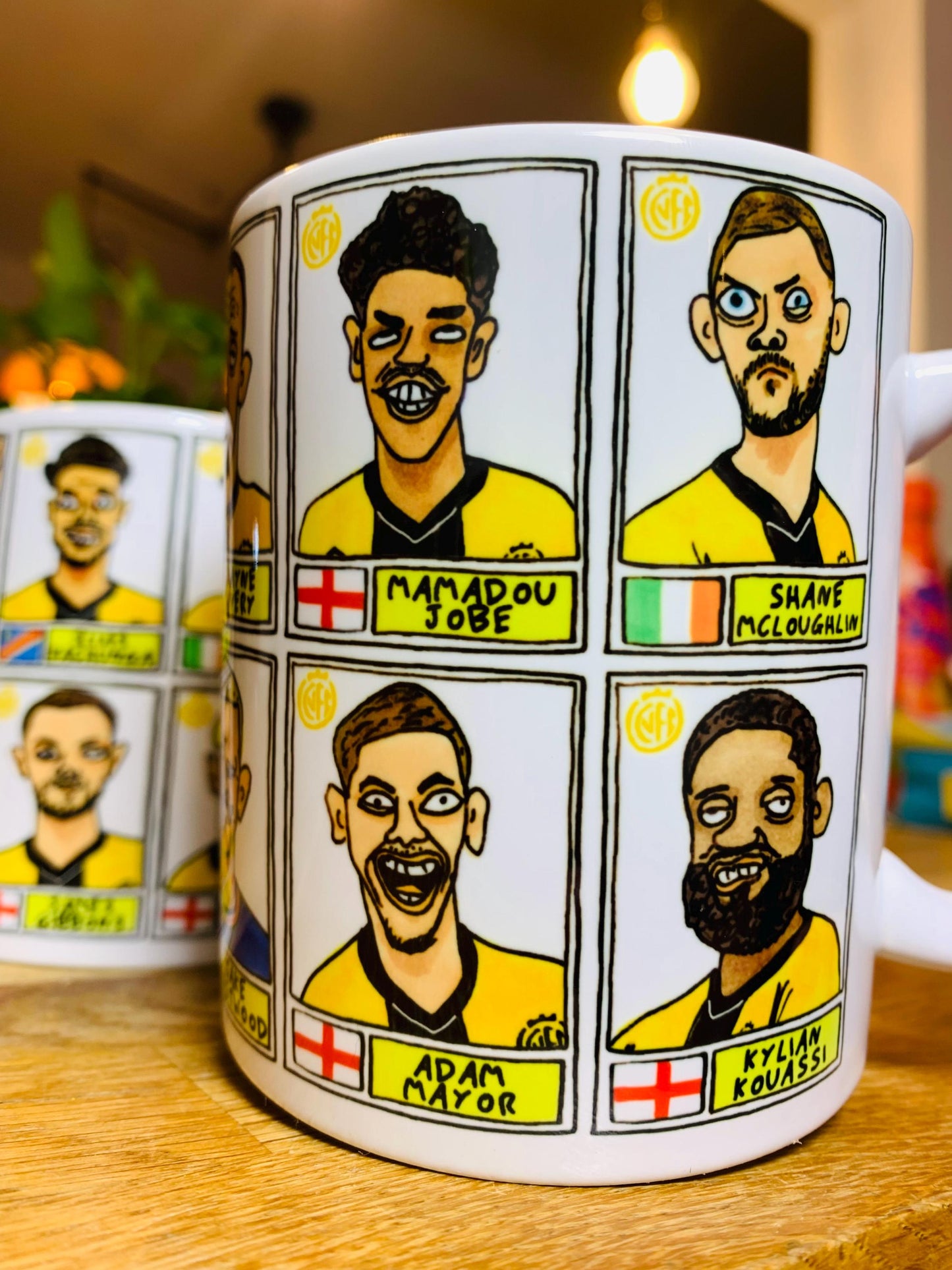 Cambridge Utd Vol 2 - U's Going Up No Score Draws Mug Set - Set of TWO DIFFERENT 11oz Ceramic Mugs with Wonky CUFC 25/26 Promotion Doodles