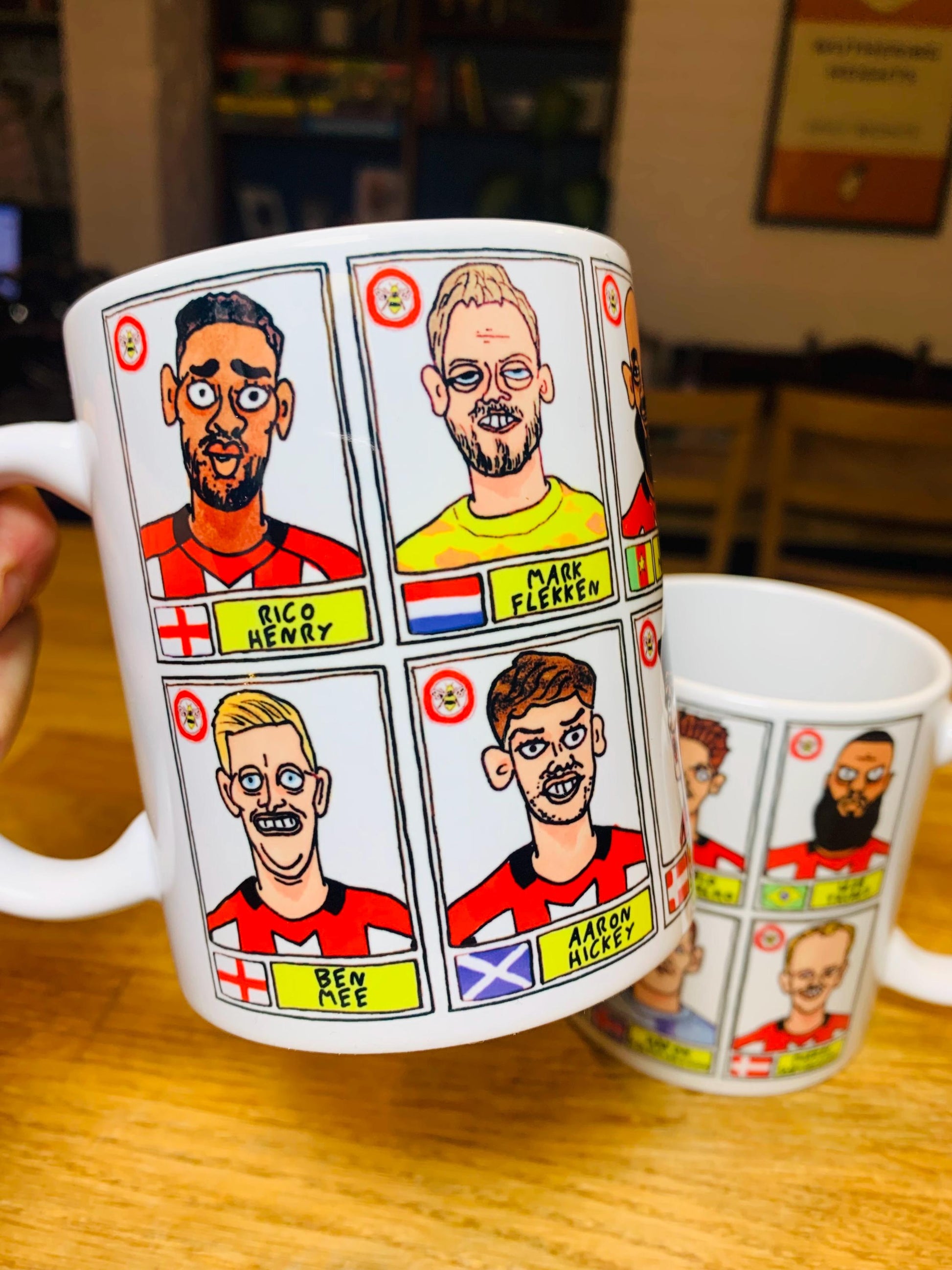 Brentford Vol 3 No Score Draws Mug Set - Set of TWO DIFFERENT 11oz Ceramic Mugs with Wonky Panini-Style Doodles Of Thomas Frank's 24/25 Team