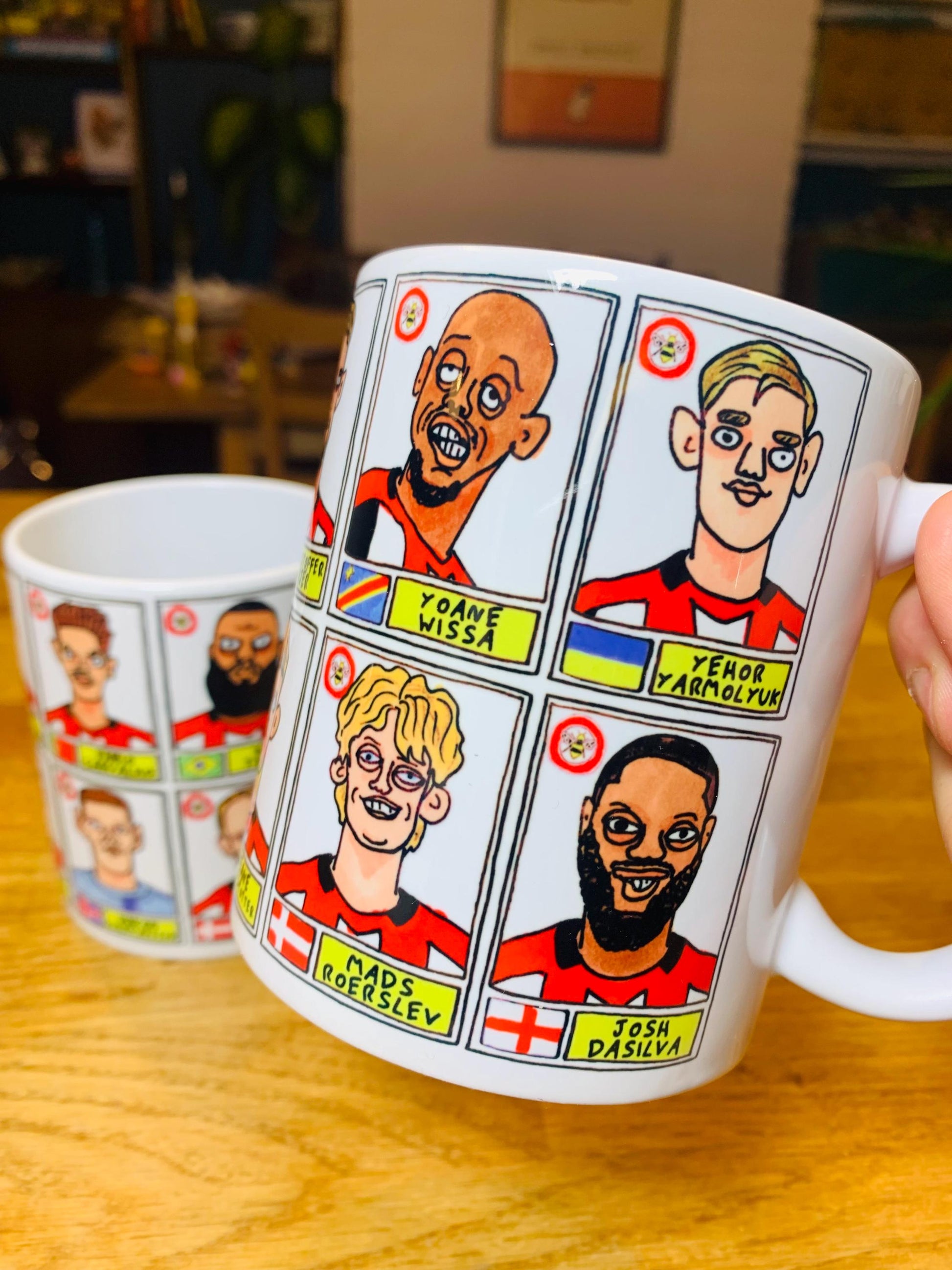 Brentford Vol 3 No Score Draws Mug Set - Set of TWO DIFFERENT 11oz Ceramic Mugs with Wonky Panini-Style Doodles Of Thomas Frank's 24/25 Team