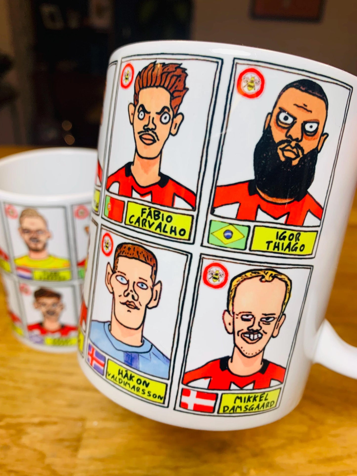 Brentford Vol 3 No Score Draws Mug Set - Set of TWO DIFFERENT 11oz Ceramic Mugs with Wonky Panini-Style Doodles Of Thomas Frank's 24/25 Team