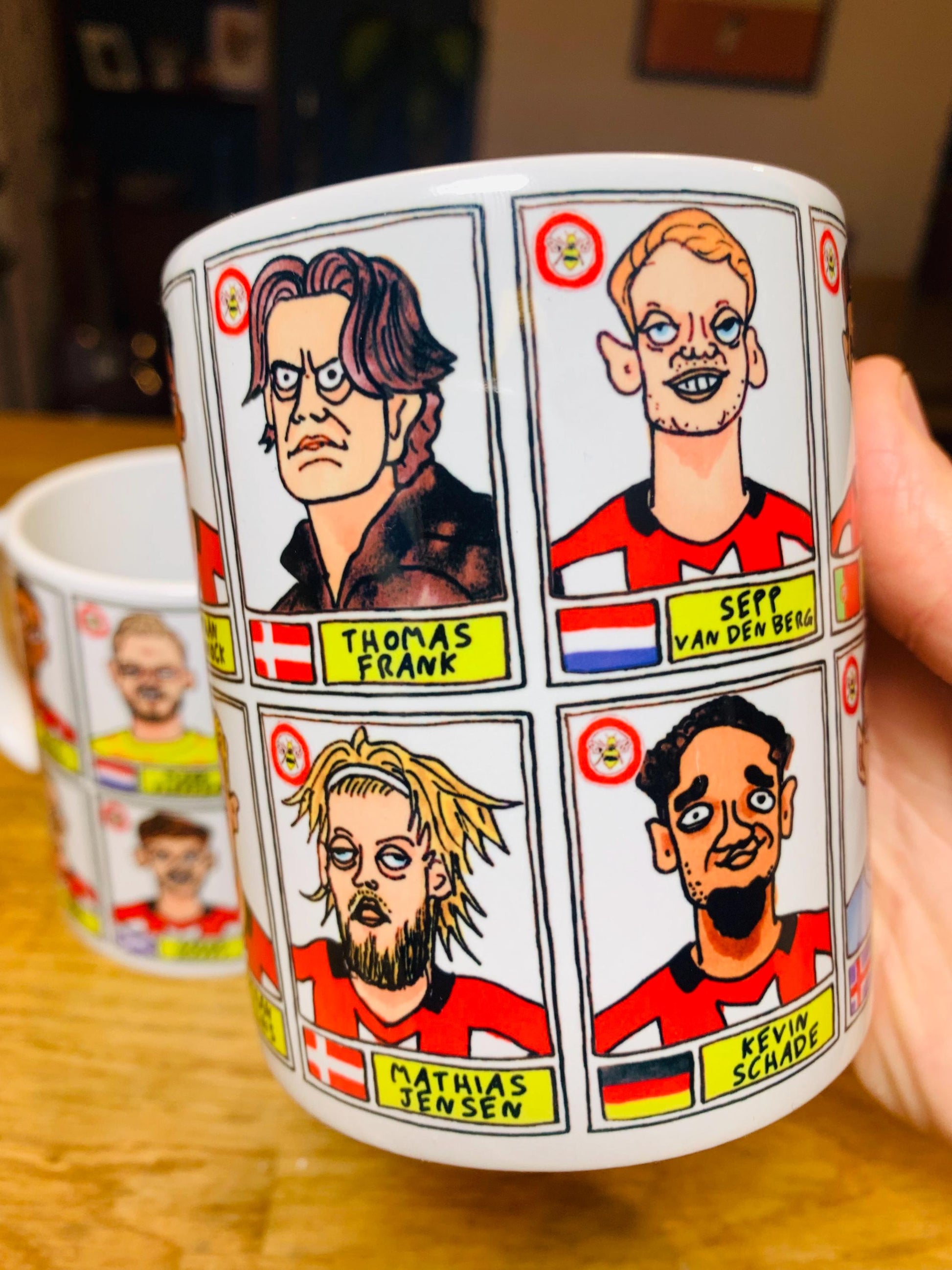 Brentford Vol 3 No Score Draws Mug Set - Set of TWO DIFFERENT 11oz Ceramic Mugs with Wonky Panini-Style Doodles Of Thomas Frank's 24/25 Team