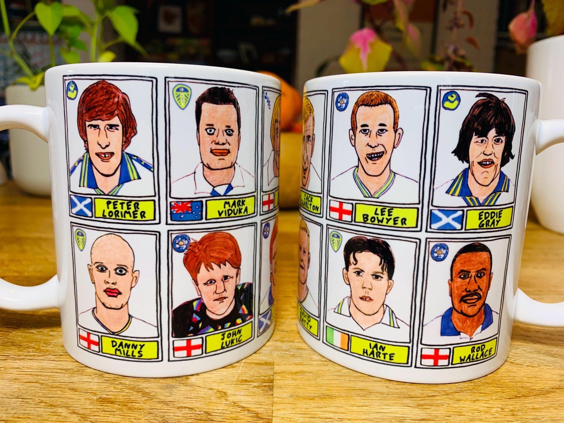 Leeds United Vol 1 No Score Draws Mug Set - Set of TWO 11oz Ceramic Mugs with Wonky Panini-style No Score Draws Doodles of LUFC legends