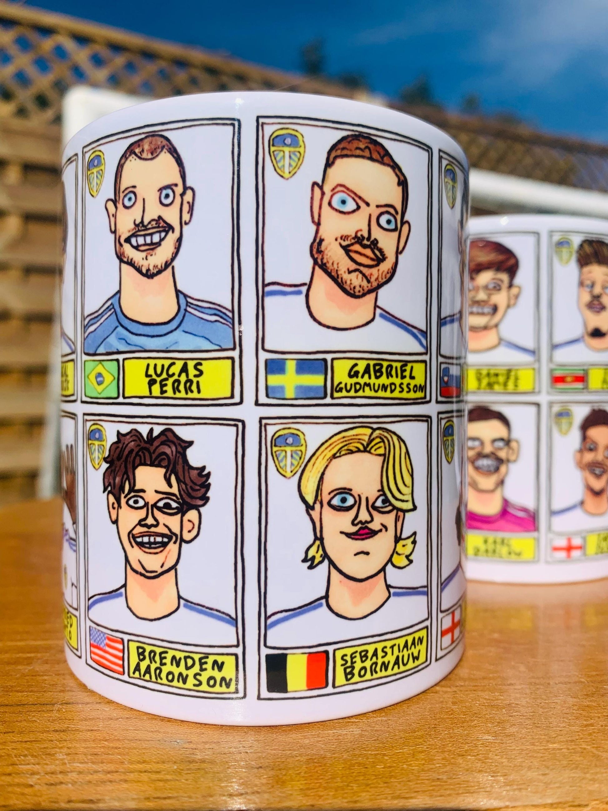 Leeds United 25/26 No Score Draws Mug Set - Set of TWO DIFFERENT 11oz Ceramic Mugs with Wonky Panini-Doodles Of Daniel Farke's PL Squad