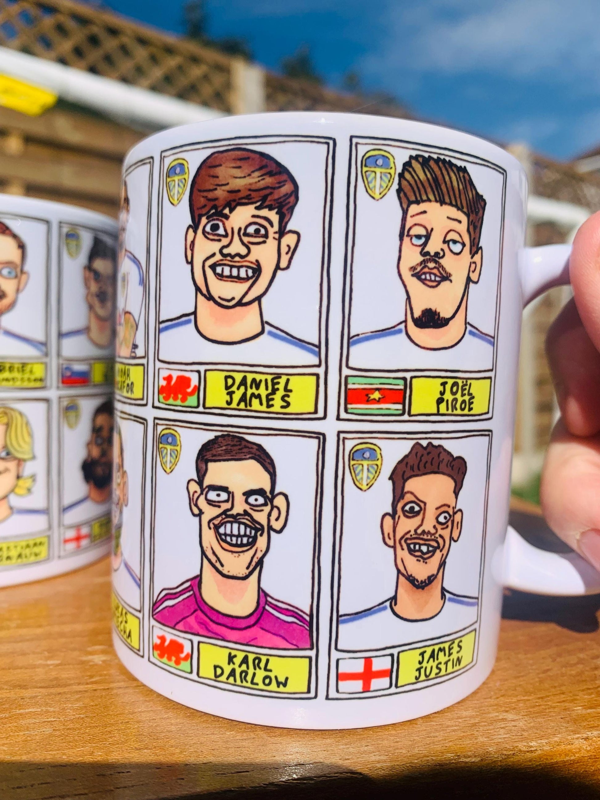 Leeds United 25/26 No Score Draws Mug Set - Set of TWO DIFFERENT 11oz Ceramic Mugs with Wonky Panini-Doodles Of Daniel Farke's PL Squad