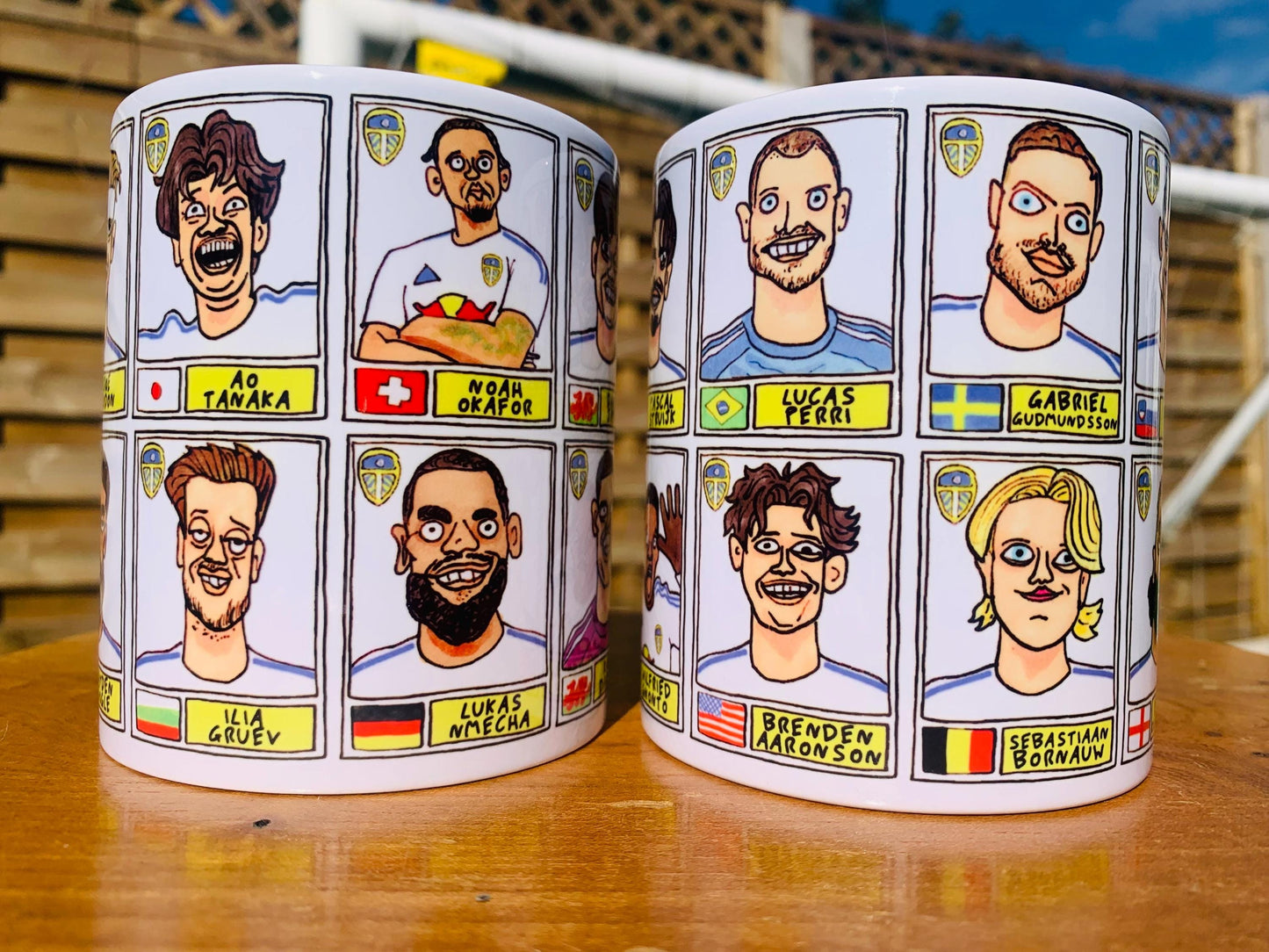 Leeds United 25/26 No Score Draws Mug Set - Set of TWO DIFFERENT 11oz Ceramic Mugs with Wonky Panini-Doodles Of Daniel Farke's PL Squad