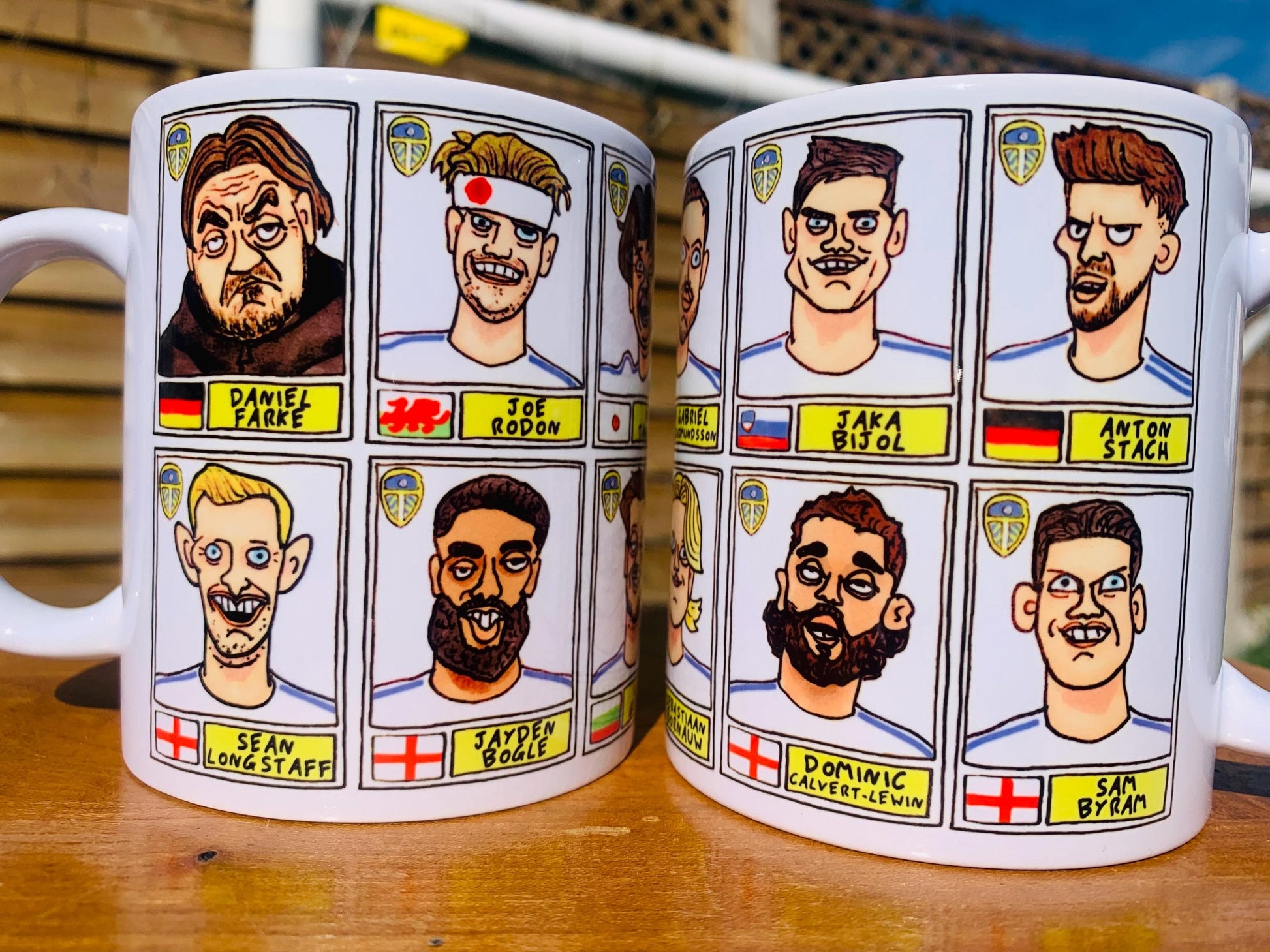 Leeds United 25/26 No Score Draws Mug Set - Set of TWO DIFFERENT 11oz Ceramic Mugs with Wonky Panini-Doodles Of Daniel Farke's PL Squad