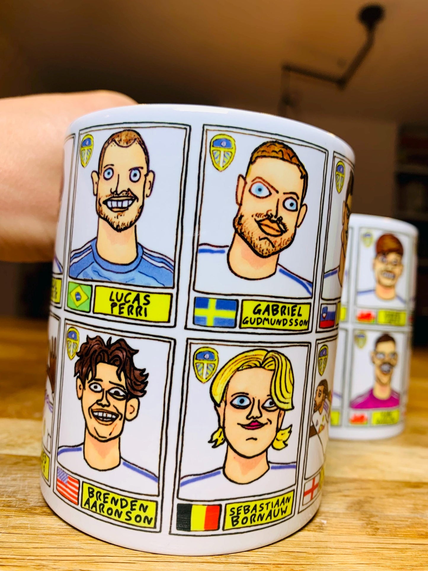 Leeds United 25/26 No Score Draws Mug Set - Set of TWO DIFFERENT 11oz Ceramic Mugs with Wonky Panini-Doodles Of Daniel Farke's PL Squad