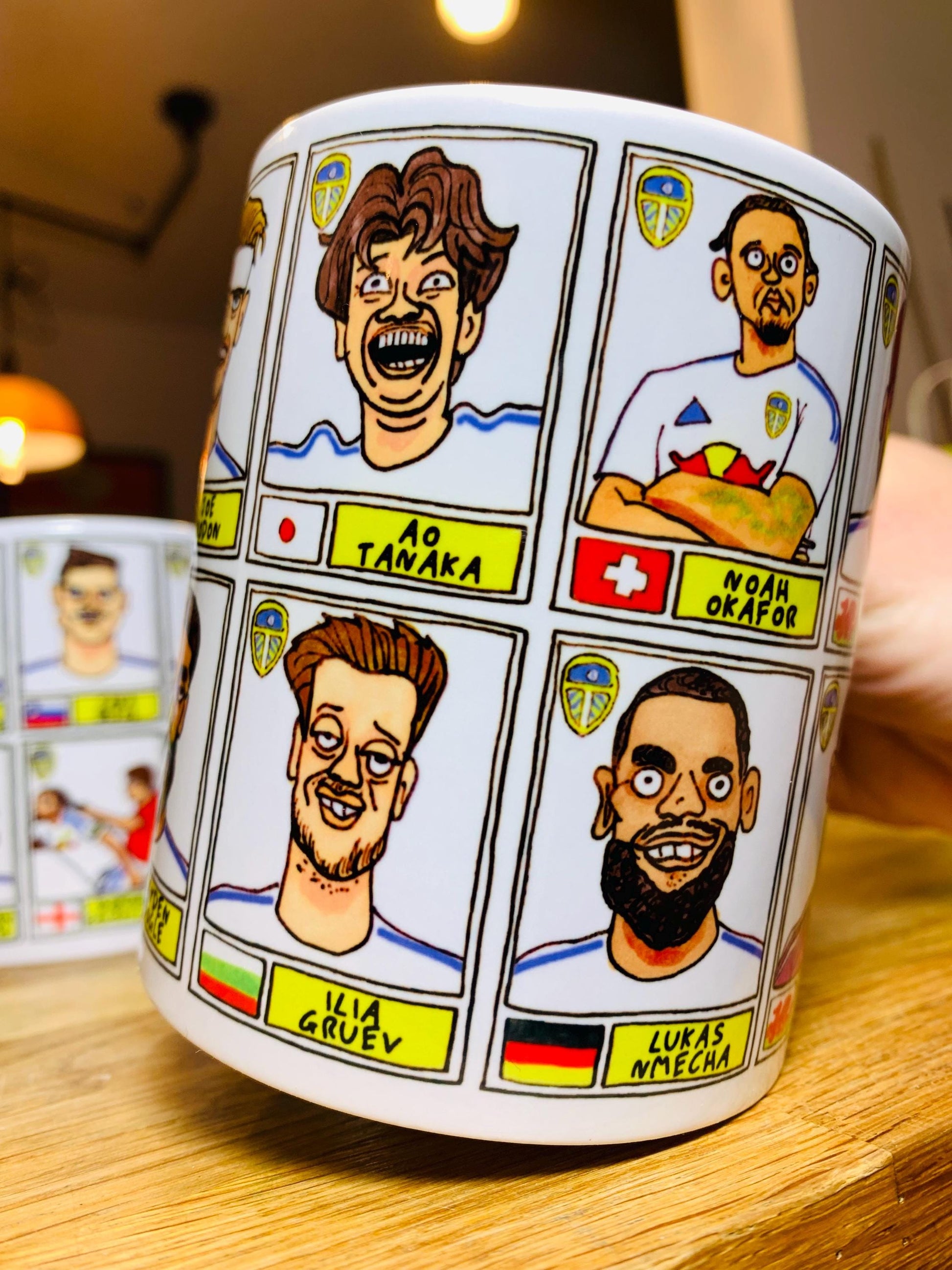Leeds United 25/26 No Score Draws Mug Set - Set of TWO DIFFERENT 11oz Ceramic Mugs with Wonky Panini-Doodles Of Daniel Farke's PL Squad