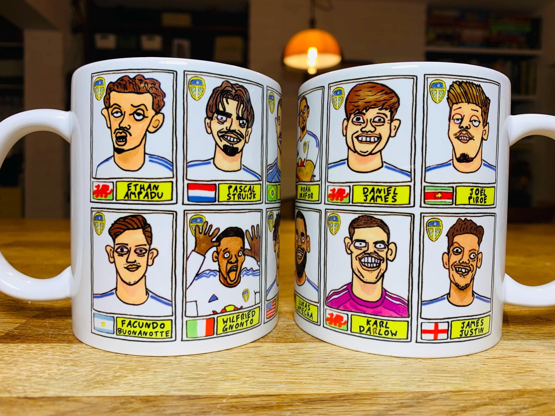 Leeds United 25/26 No Score Draws Mug Set - Set of TWO DIFFERENT 11oz Ceramic Mugs with Wonky Panini-Doodles Of Daniel Farke's PL Squad