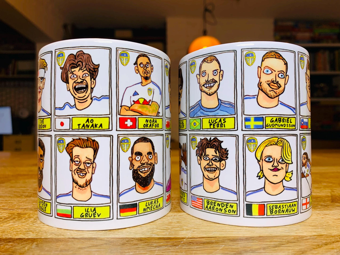 Leeds United 25/26 No Score Draws Mug Set - Set of TWO DIFFERENT 11oz Ceramic Mugs with Wonky Panini-Doodles Of Daniel Farke's PL Squad