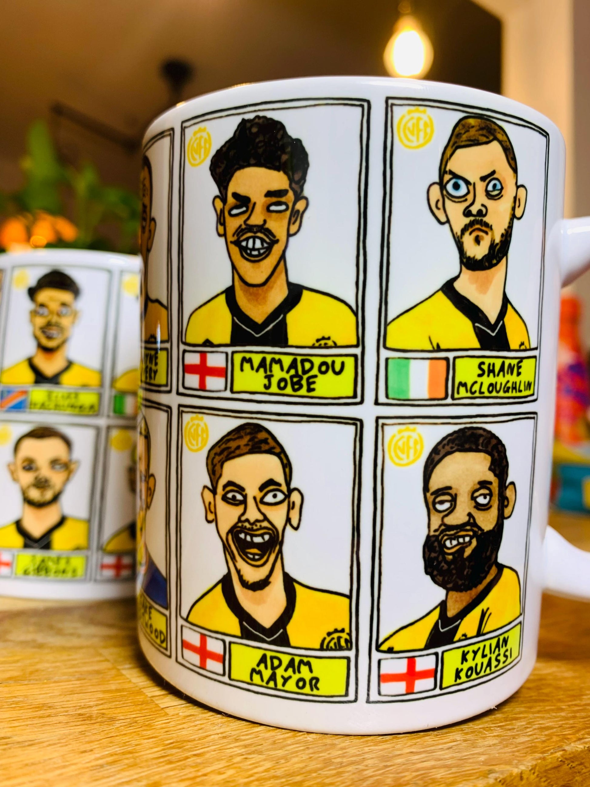 Cambridge Utd Vol 2 - U's Going Up No Score Draws Mug Set - Set of TWO DIFFERENT 11oz Ceramic Mugs with Wonky CUFC 25/26 Promotion Doodles