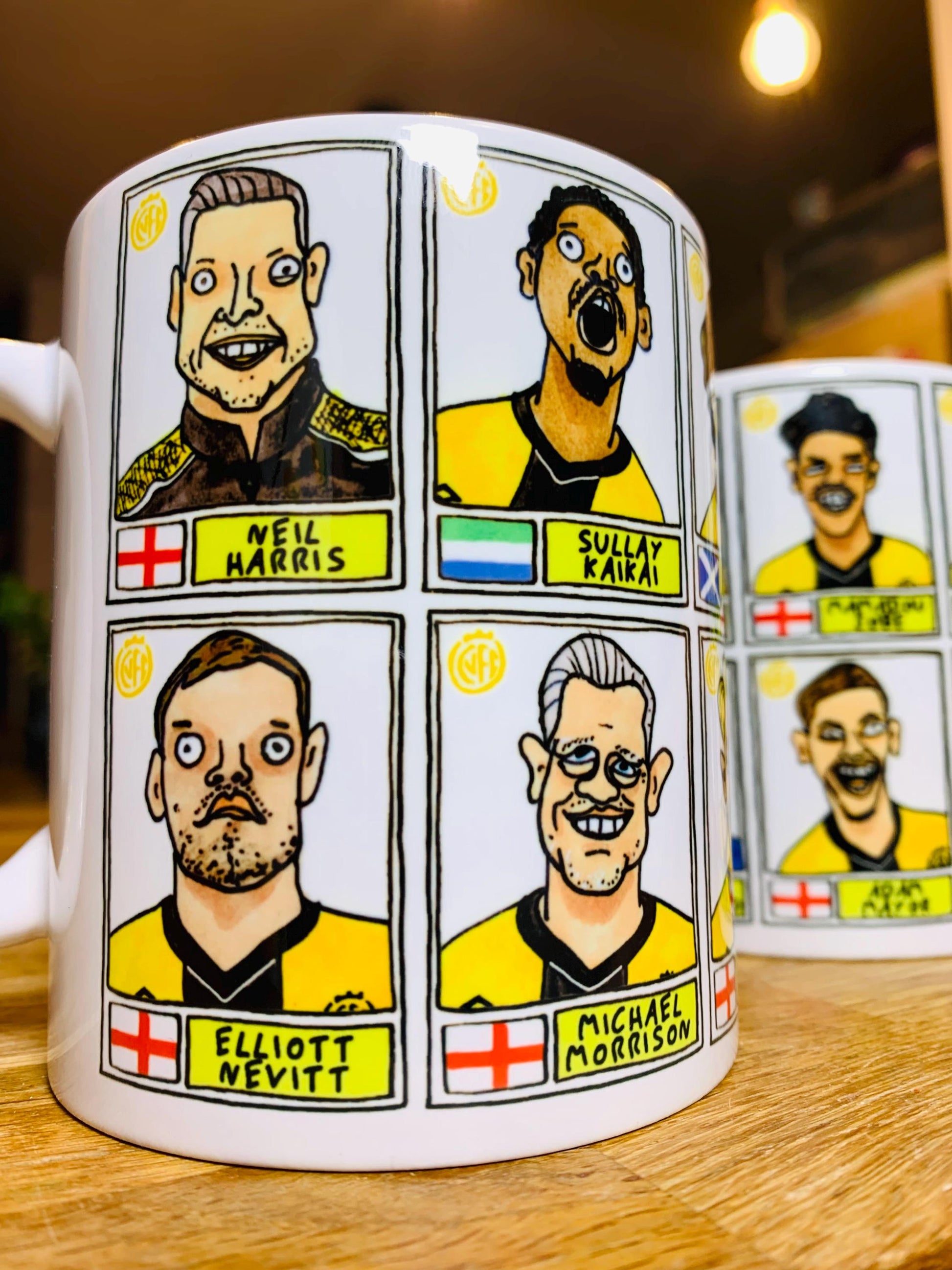 Cambridge Utd Vol 2 - U's Going Up No Score Draws Mug Set - Set of TWO DIFFERENT 11oz Ceramic Mugs with Wonky CUFC 25/26 Promotion Doodles