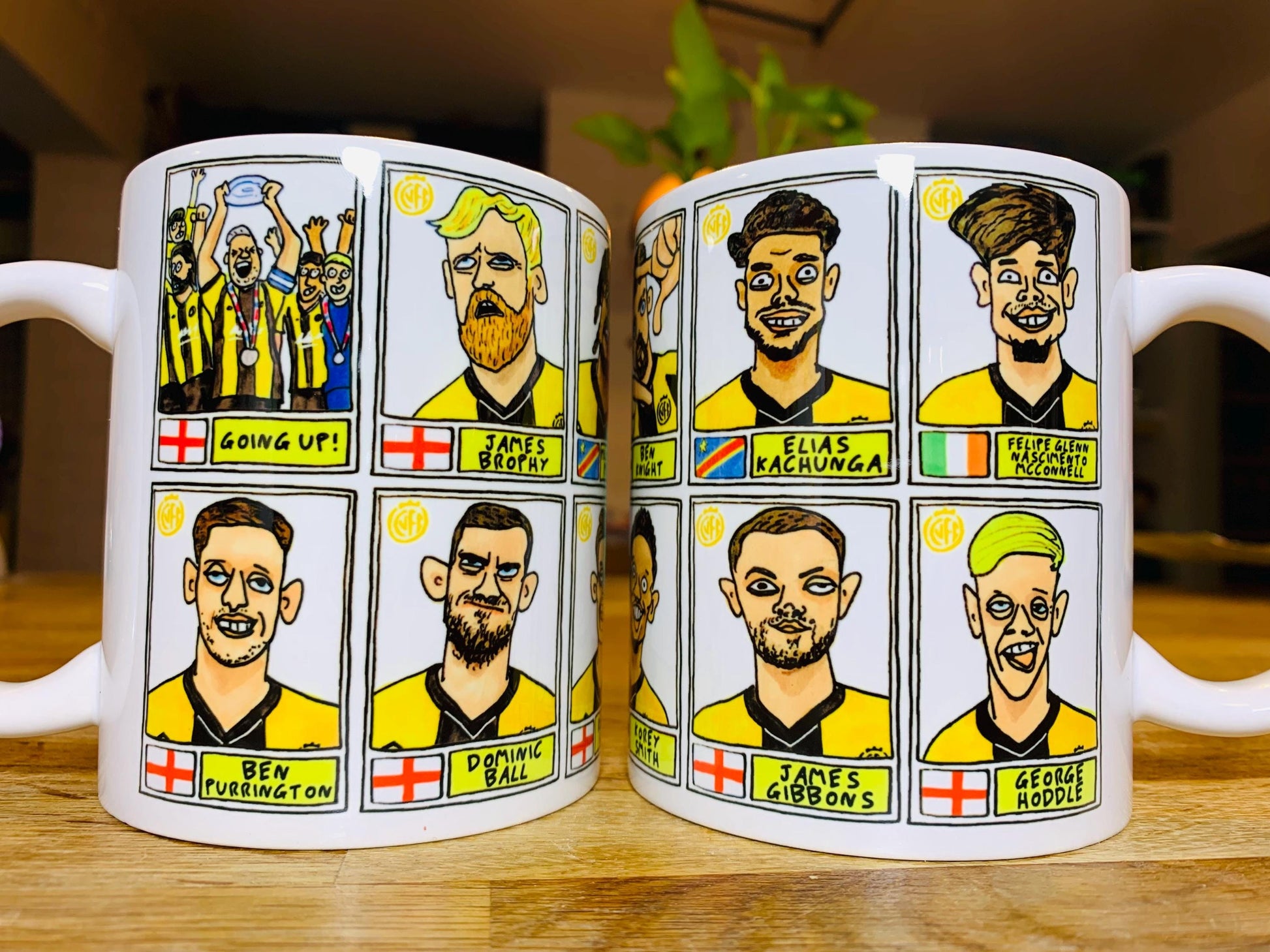 Cambridge Utd Vol 2 - U's Going Up No Score Draws Mug Set - Set of TWO DIFFERENT 11oz Ceramic Mugs with Wonky CUFC 25/26 Promotion Doodles