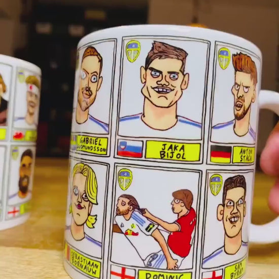 Leeds United 25/26 No Score Draws Mug Set - Set of TWO DIFFERENT 11oz Ceramic Mugs with Wonky Panini-Doodles Of Daniel Farke's PL Squad