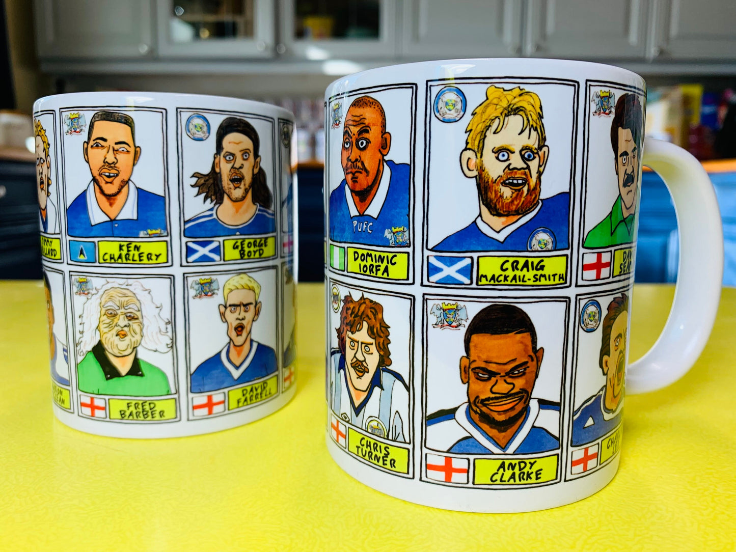 Peterborough Utd Vol 2 Mug Set - Set of TWO 11oz Ceramic Mugs with Wonky Panini-style No Score Draws Doodles of various historic PUFC icons