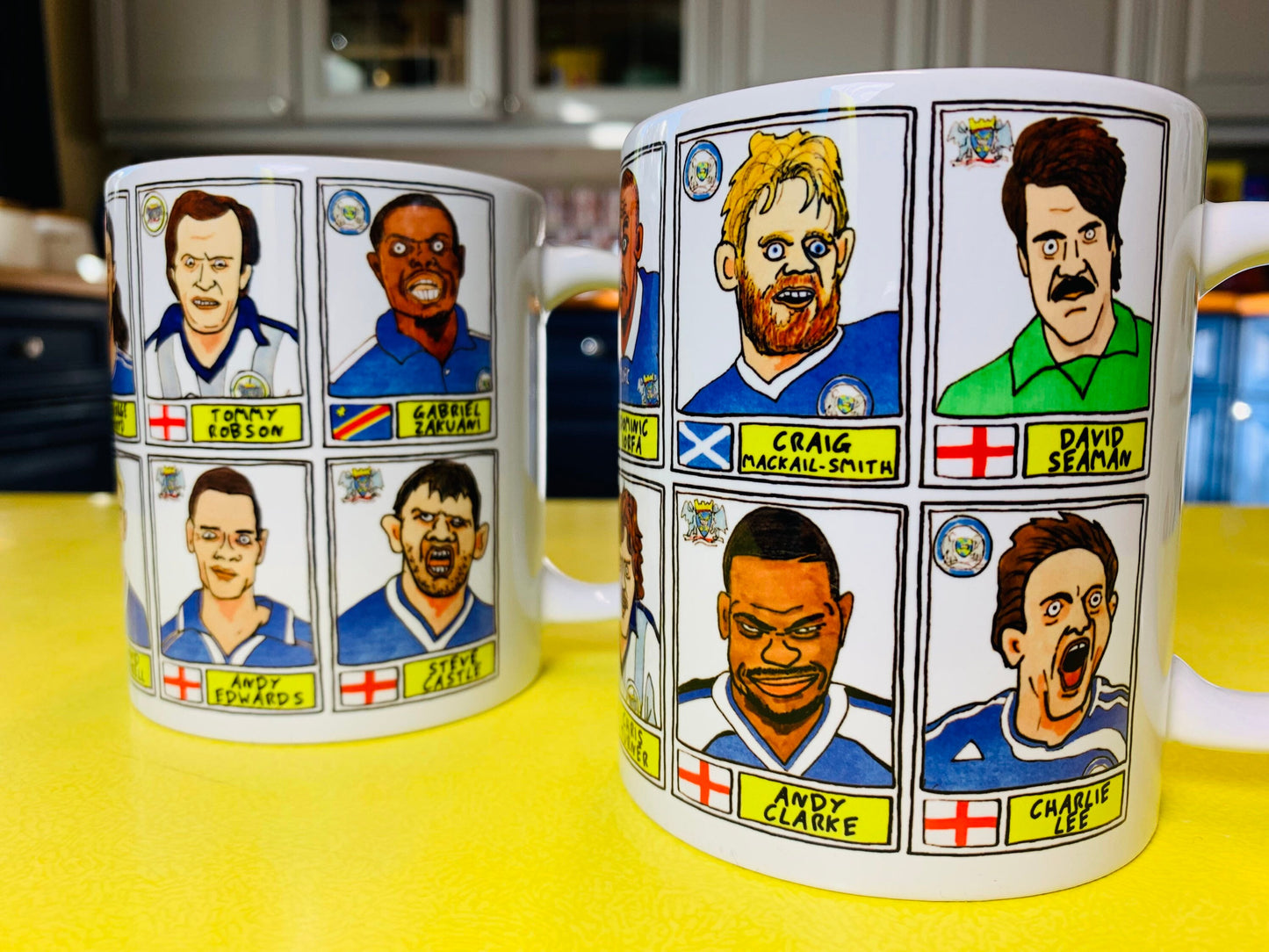 Peterborough Utd Vol 2 Mug Set - Set of TWO 11oz Ceramic Mugs with Wonky Panini-style No Score Draws Doodles of various historic PUFC icons